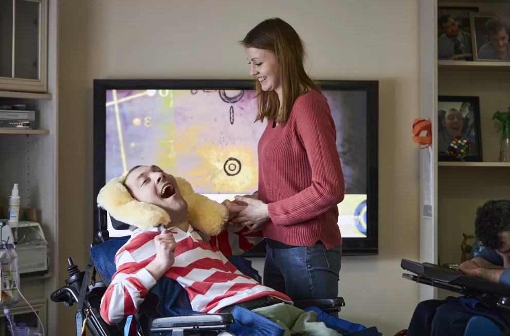 Lighthouse client and support worker sharing a moment together